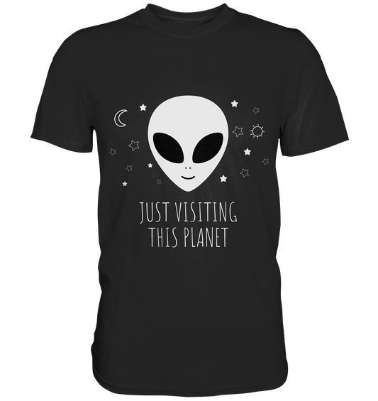 Schwarzes T-Shirt mit Alien-Motiv und Spruch „Just visiting this planet“ – spacig, witzig und individuell.