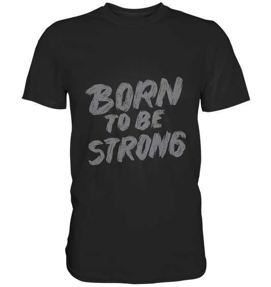 Schwarzes T-Shirt mit grauem Gothic-Schriftzug „Born to be strong“, minimalistisch und düster.