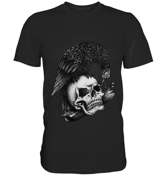 Schwarzes T-Shirt mit weißem Motiv: realistische Krähe sitzt auf Schädel und hält ein Auge im Schnabel